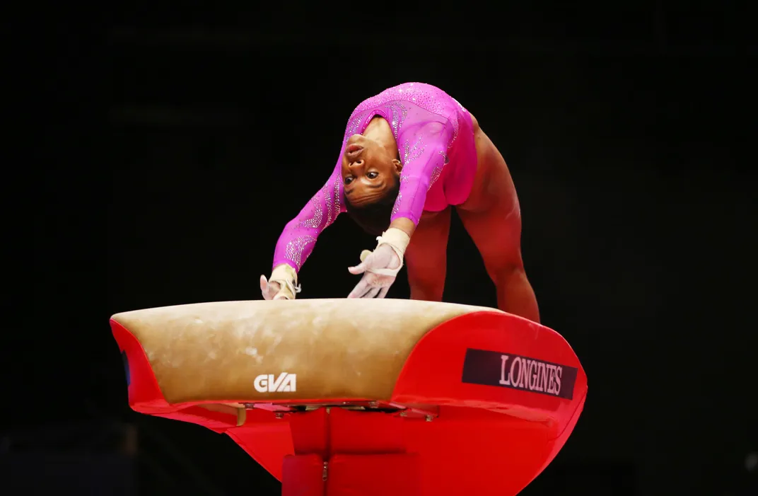 Gabby Douglas, the 2012 women's all-around champion, competes on the vault during the 2015 World Artistic Gymnastics Championships in Glasgow, Scotland.