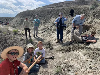 The three young explorers participated in the excavation of the fossilized remains.